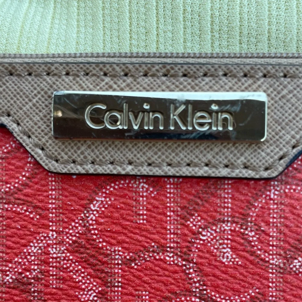 Calvin Klein Wristlet Women’s zipper coin purse 5x7‎ Orange W/Tan Trim w/CK logo
